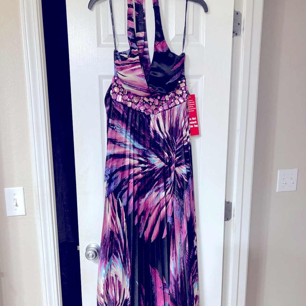 Pleated maxi halter dress with jeweled bodice.